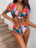 Red women's printed split swimsuit bikini made from nylon fabric.