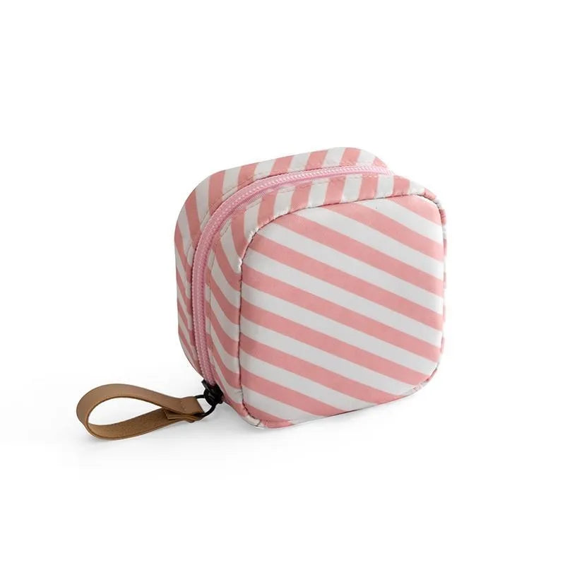 Cloth cube-shaped makeup storage bag shown in blue, pink, white, and white pink colour options.