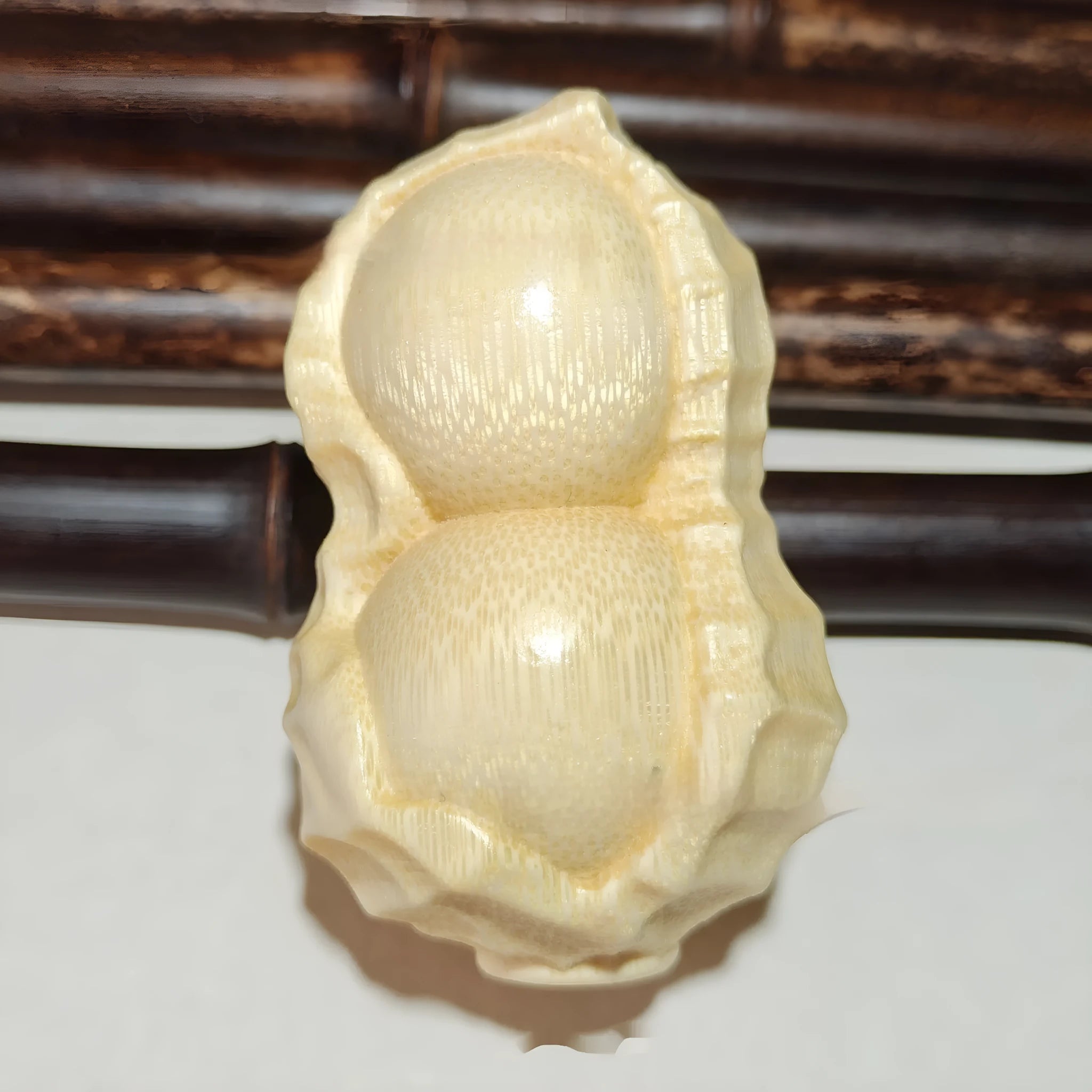 Solid bamboo peanut ornament carving with May Good Things Happen message
