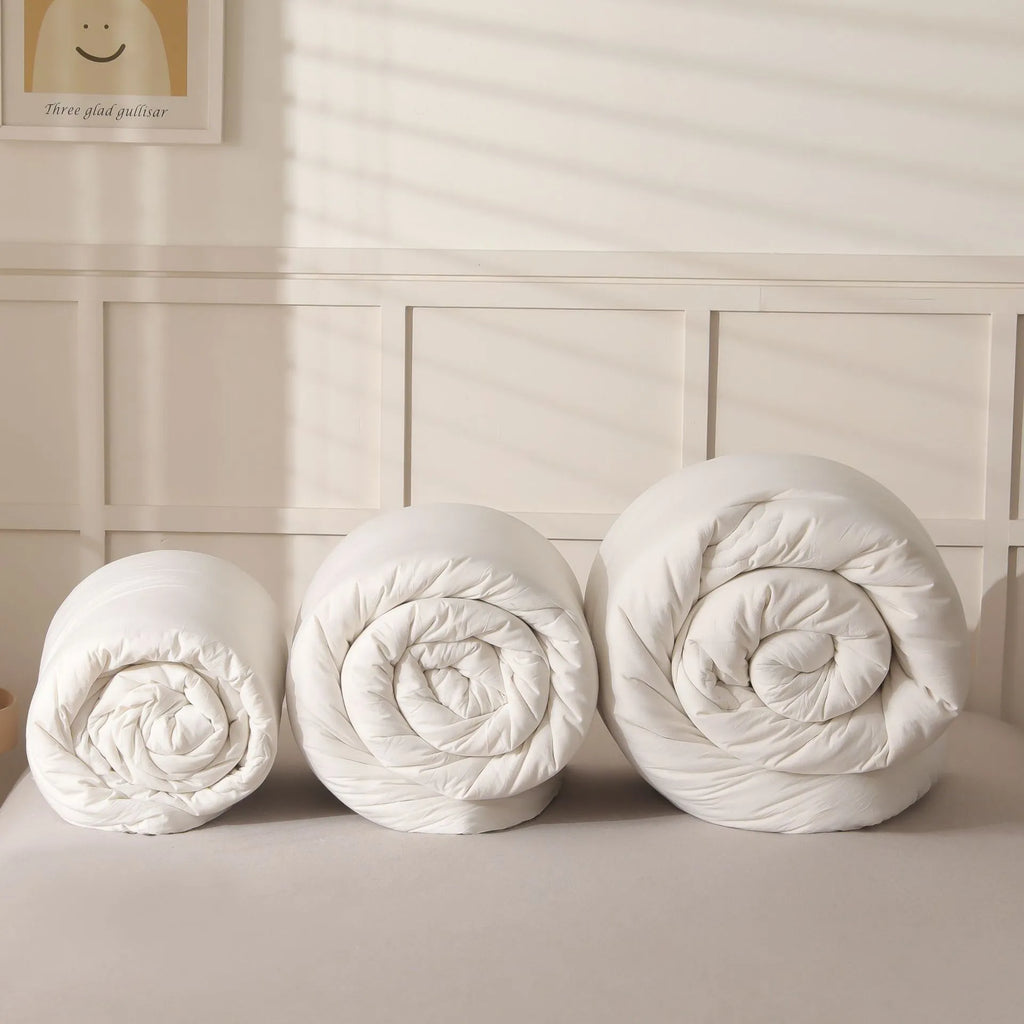 Soybean fibre filled quilt with pure cotton cover in grey, showing twill weave texture on a bed.