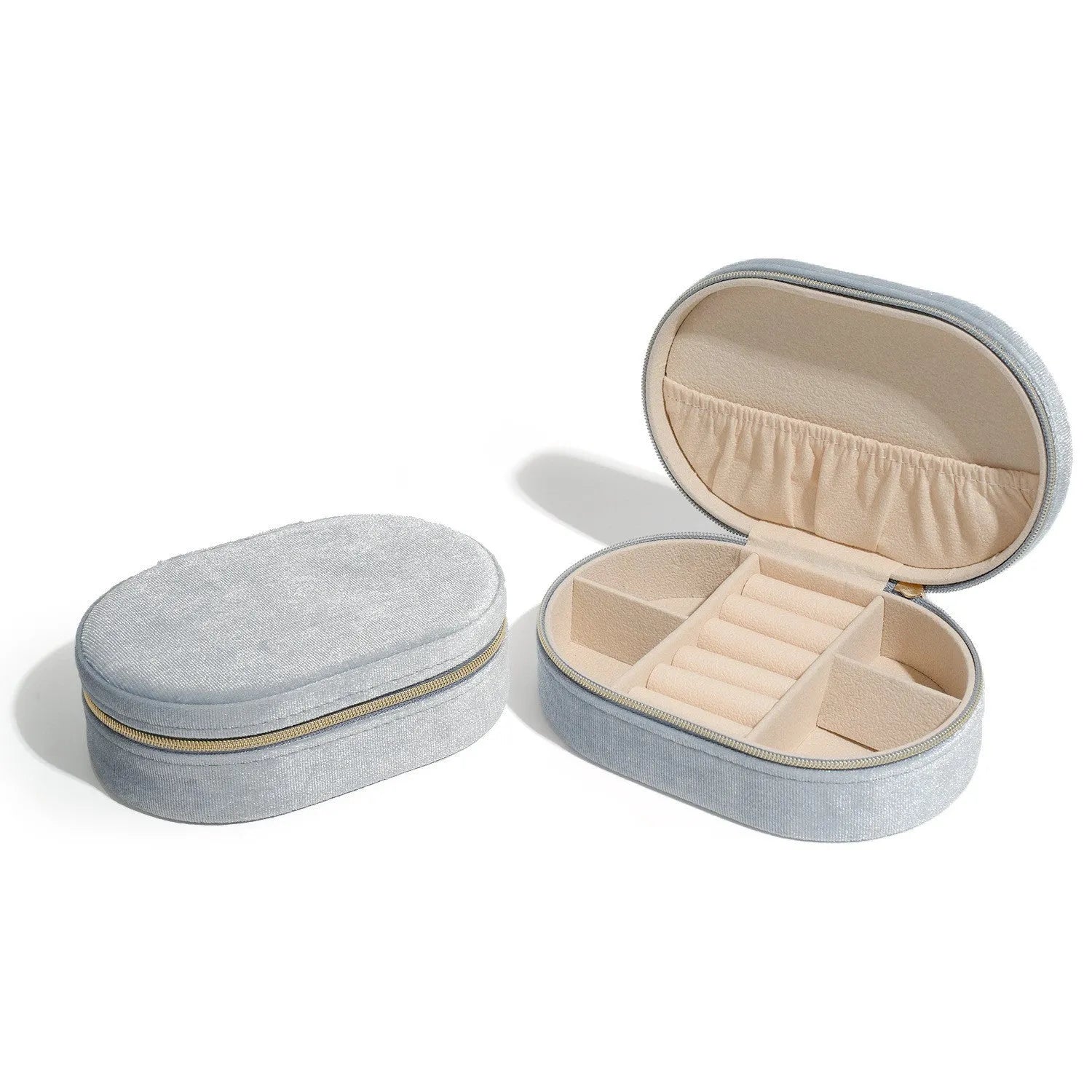 Oval velvet jewelry storage box in lake blue colour showing compact 15x10x5cm dimensions with flannel interior