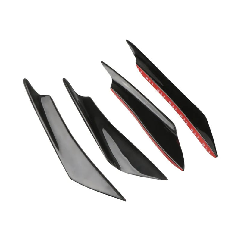 Set of four carbon fibre effect ABS plastic bumper air knife spoilers for car styling.