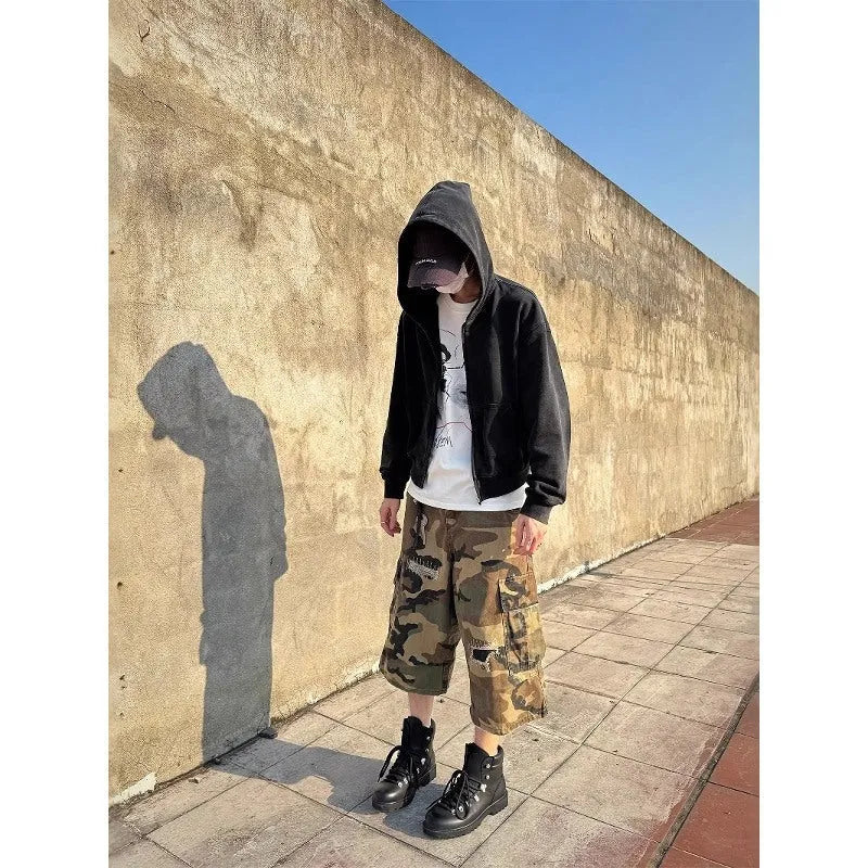 Men's loose camouflage jeans with retro patches and ripped detailing in cropped straight cut