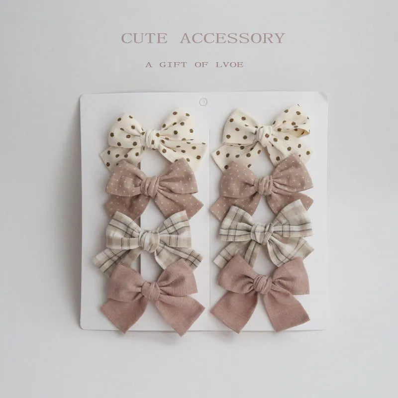 Children's fabric dovetail bow hair clips in eight pattern options