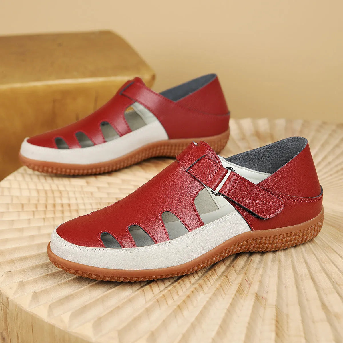 Plus size women's flat sandals with toe cap and hollow breathable design in blue, red, or white.