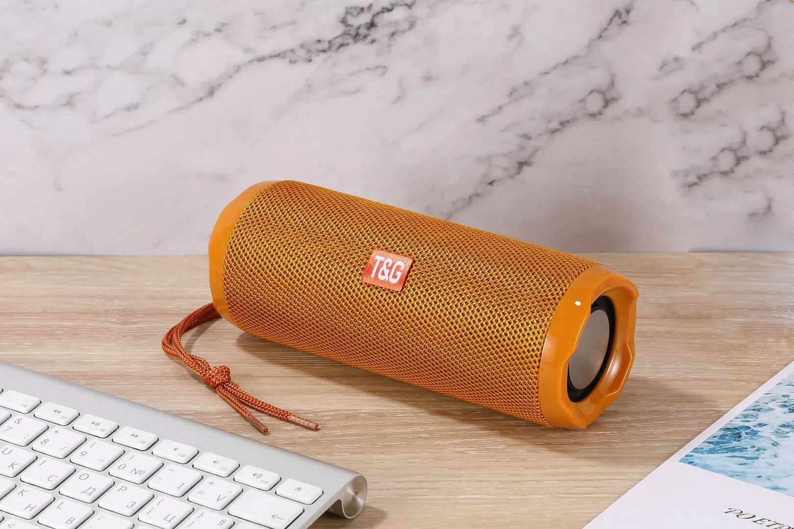 Fabric-covered portable Bluetooth speaker with integrated card holder slot in blue colour