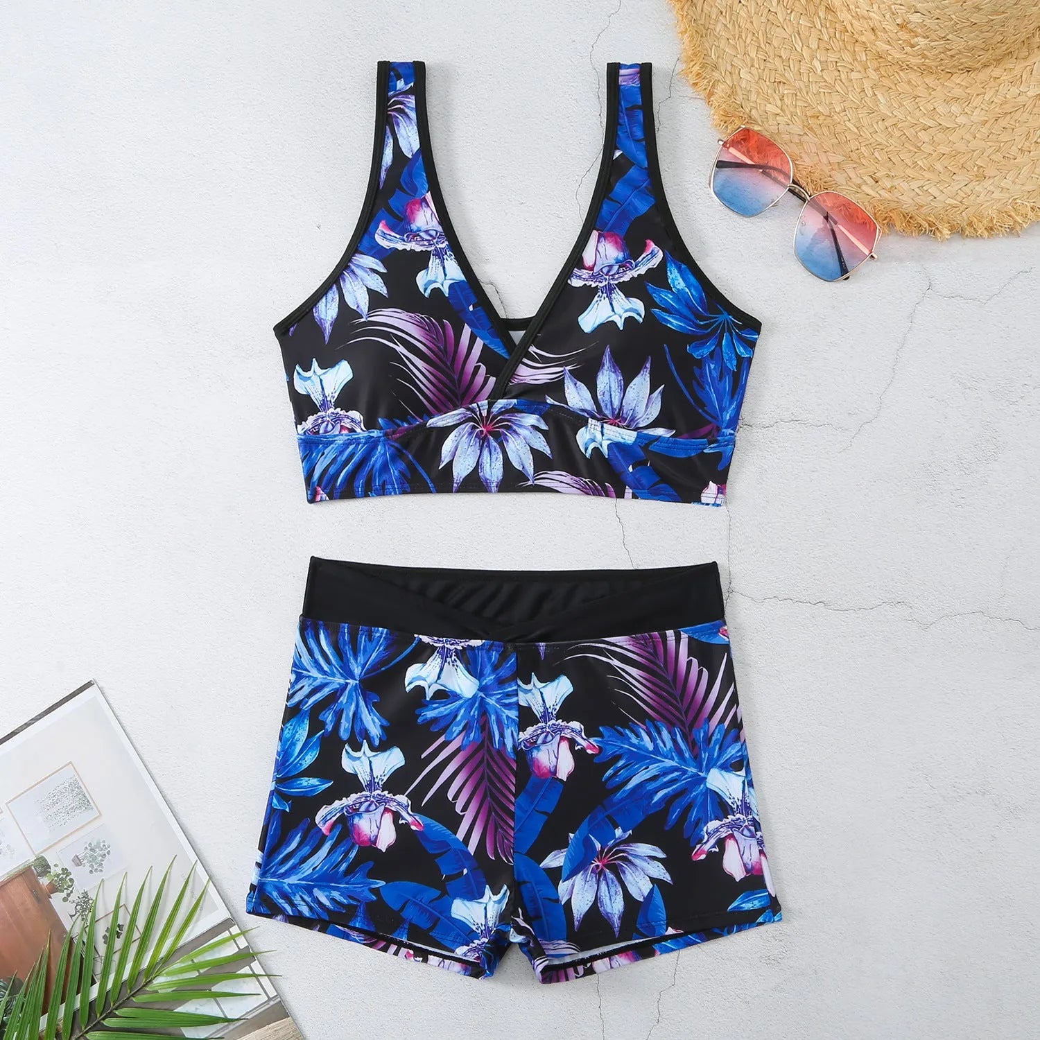 Women's two-piece swimsuit with sleeveless top and printed boxer shorts in multiple colours.
