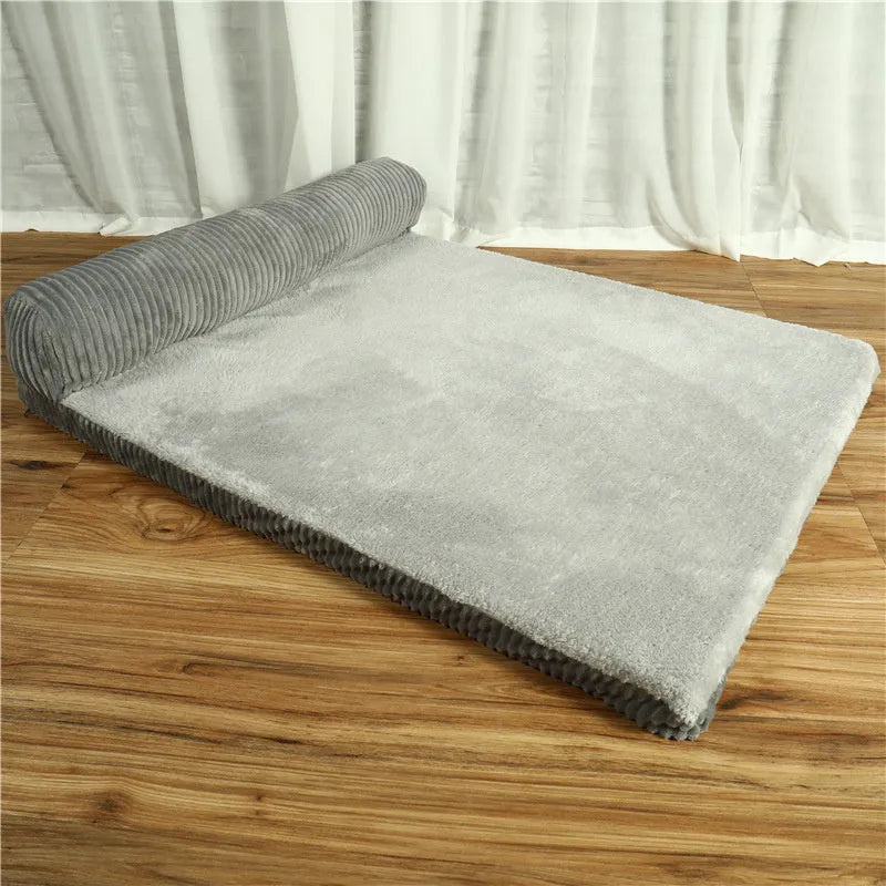 Corduroy pet sofa dog bed in grey colour with a non-slip base, shown in a bilateral style.