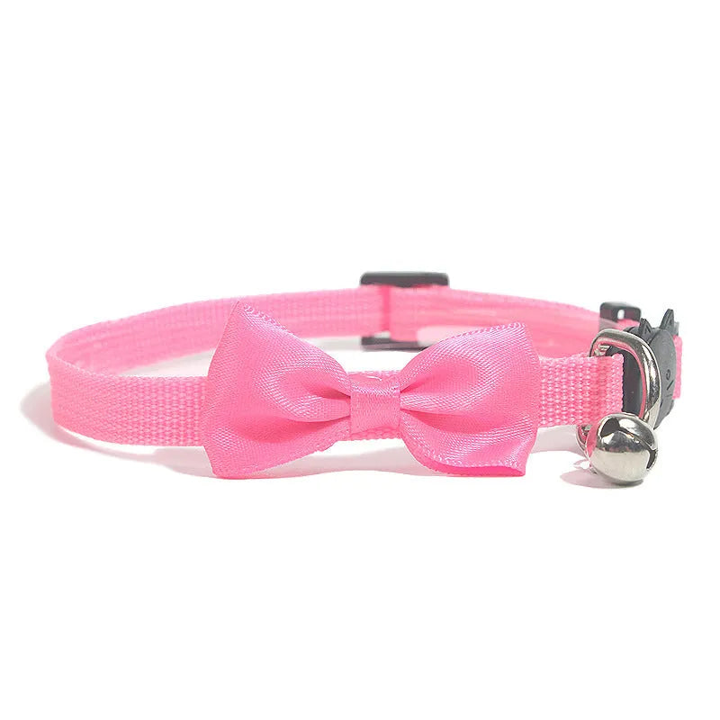 Adjustable nylon cat collar with decorative bow and bell in multiple colour options including red, blue, pink and green