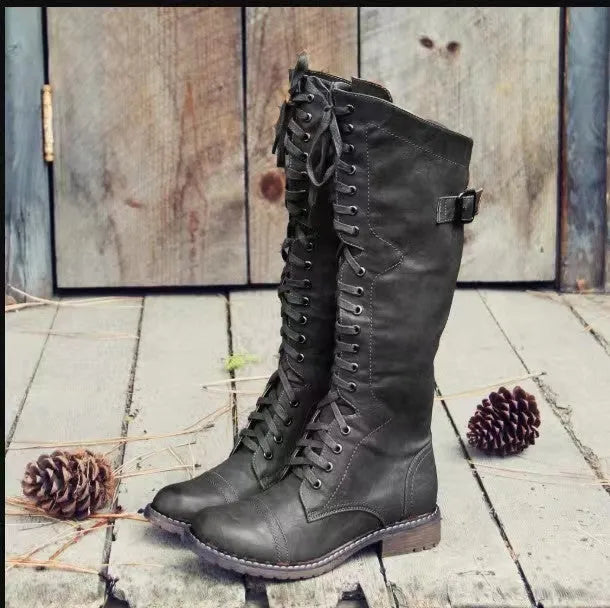 Chunky low heel high leg boots in black, brown, and wine red with rounded toe.