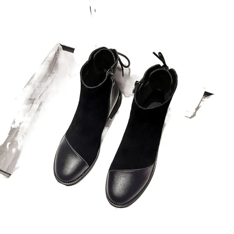 Women's black knee-high Martin boots with side zip closure and bow detailing