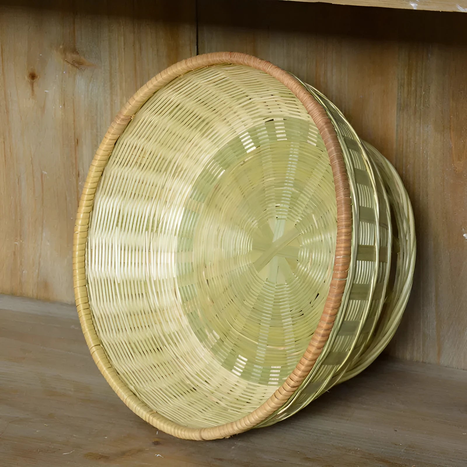 Handmade woven bamboo storage basket in natural colour showing traditional craftsmanship