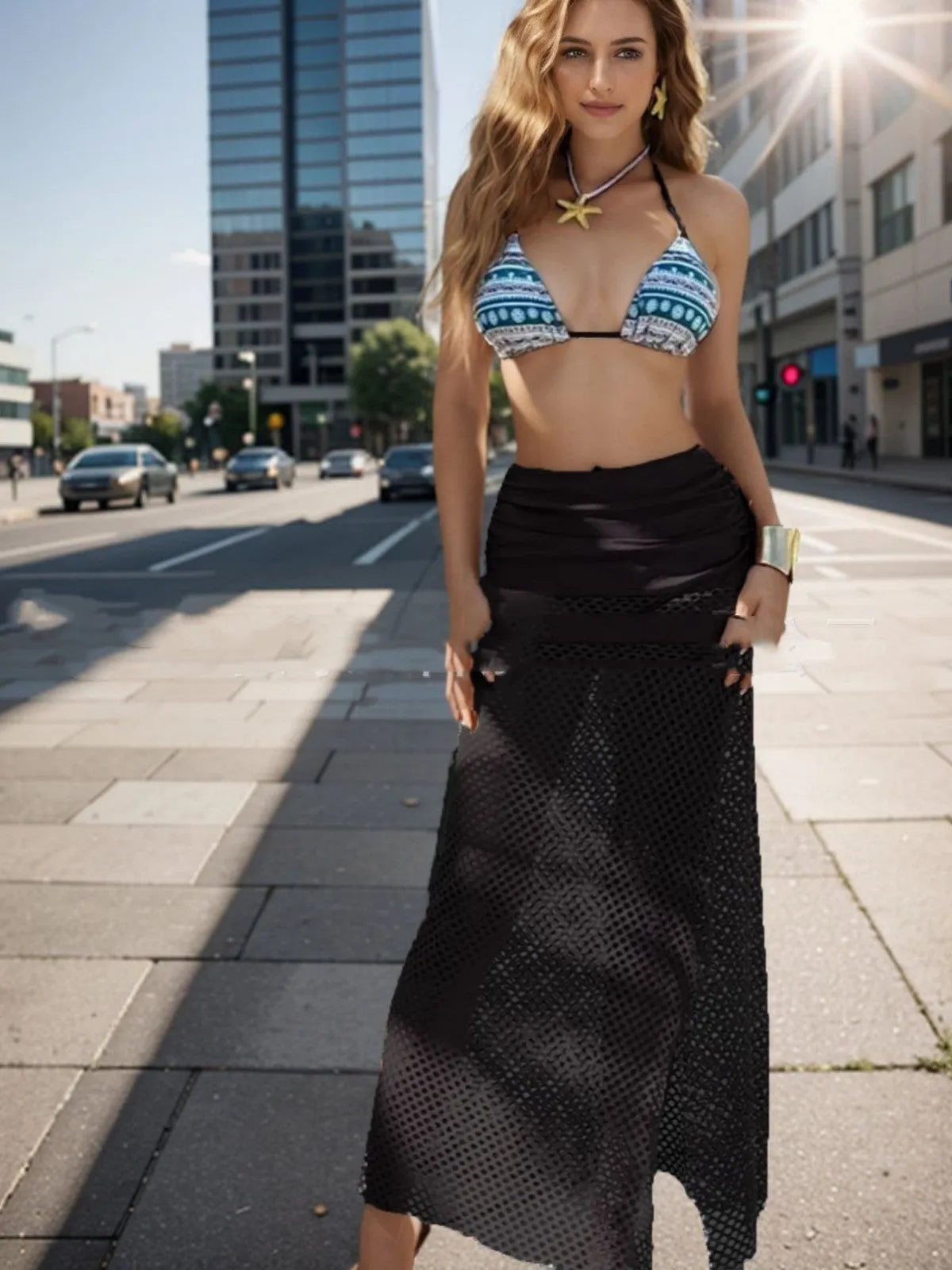 Women's brown gradient bikini set with fishnet long skirt, laid flat showing all three pieces.