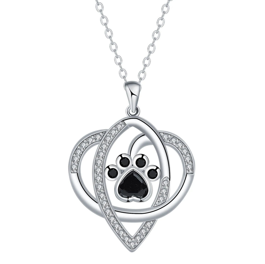 Copper pendant necklace showing a detailed cat and dog paw print design on a cross chain.