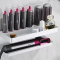 White double-layer aluminium bathroom storage rack holding Marcel Waver hair curlers with adhesive mounting
