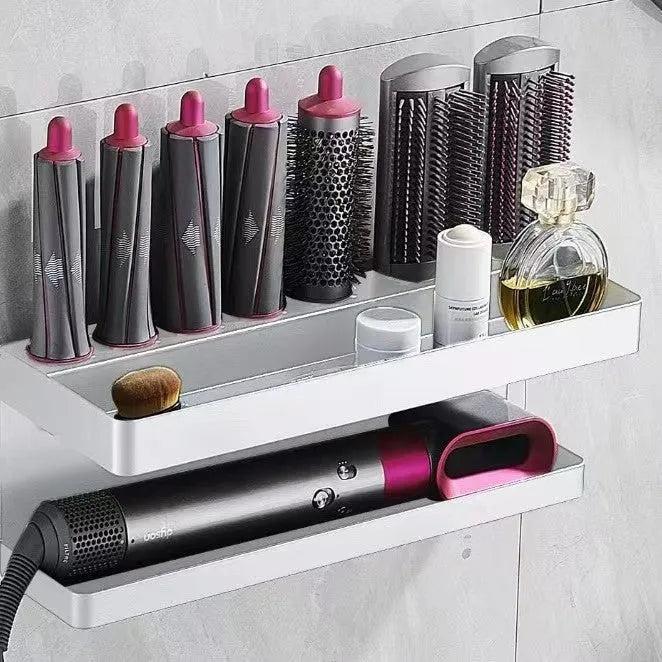 White double-layer aluminium bathroom storage rack holding Marcel Waver hair curlers with adhesive mounting