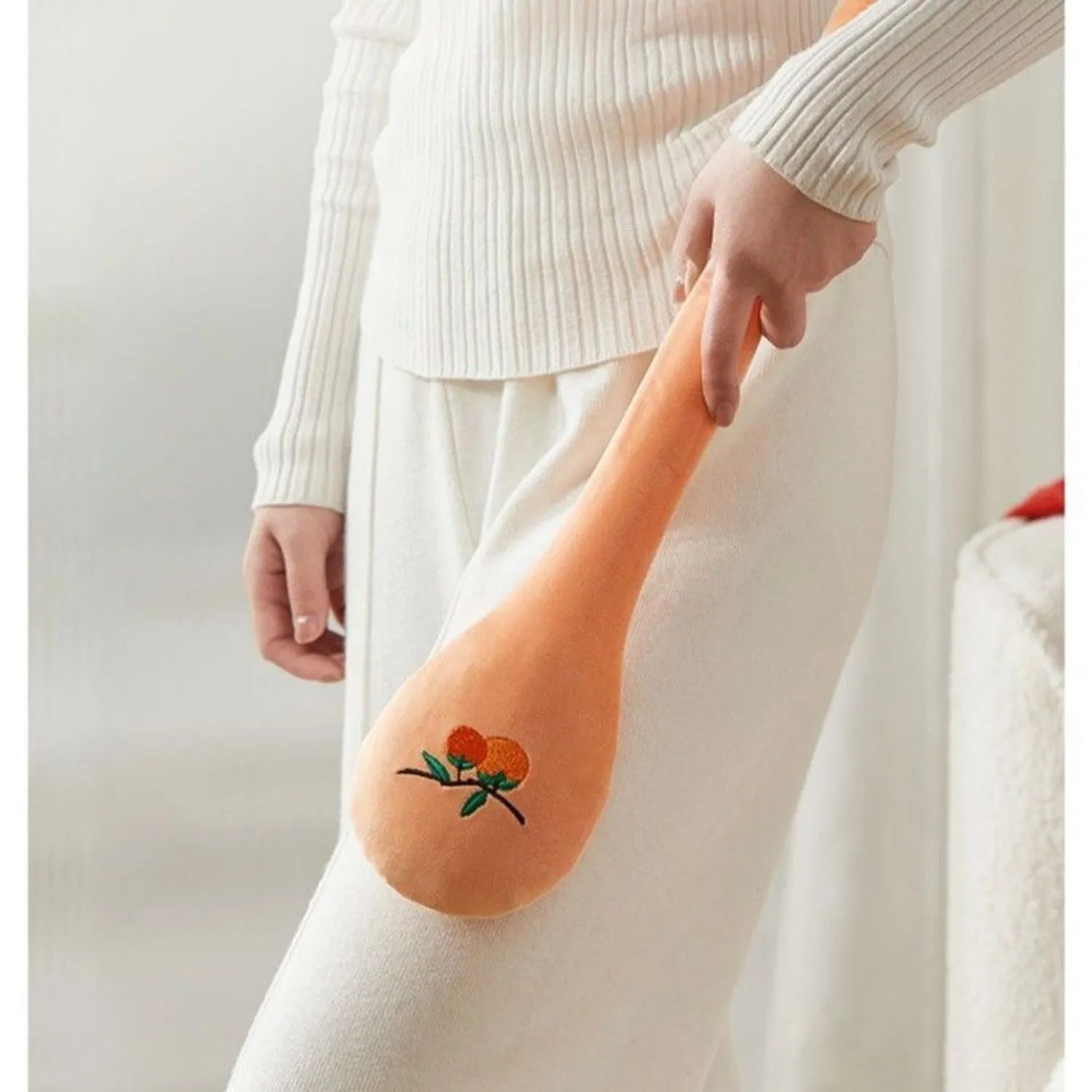 48 cm long manual massage stick with a zipper style design and a meridian flap for percussion therapy.