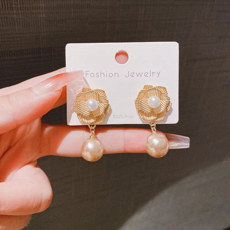 Gold colour flower stud earrings with rose pearl centre and opal stone details