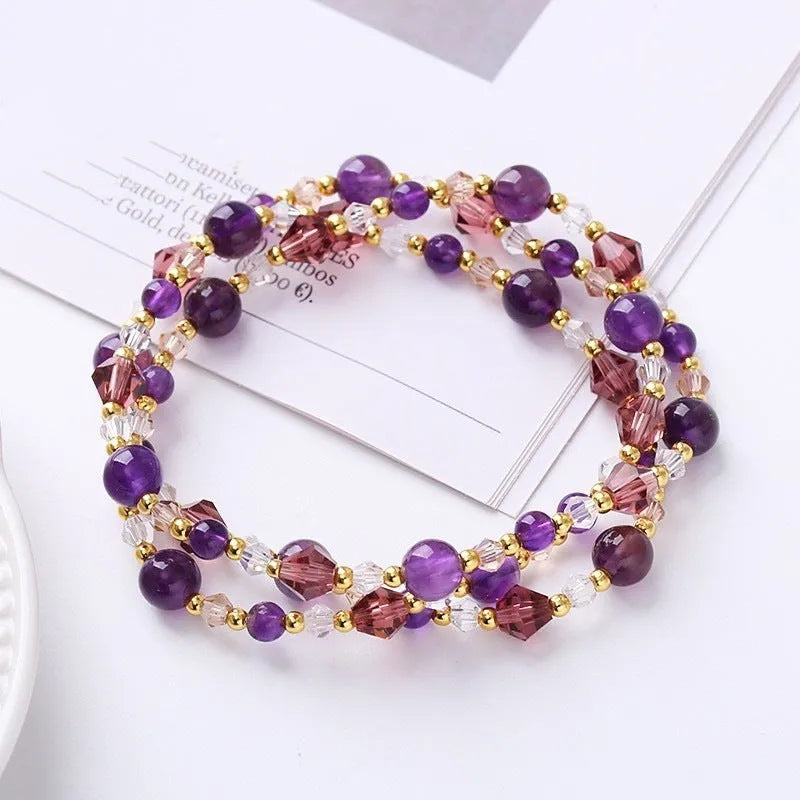 Women's three-ring crystal bracelet with tourmaline, strawberry quartz, and amethyst beads on adjustable cord.