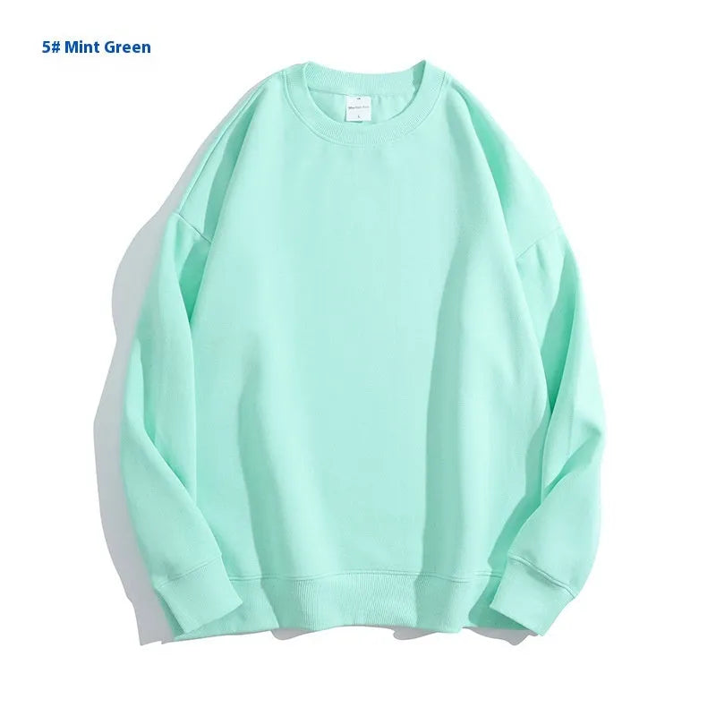 Women's loose fit cotton off shoulder sweater in a solid colour with round neck and long sleeves.