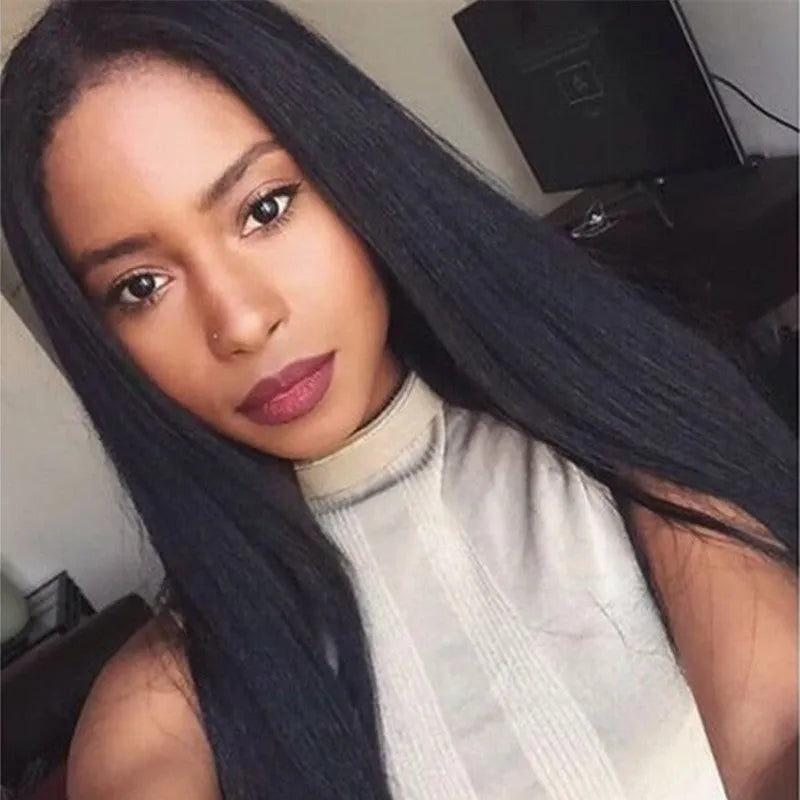 Long straight black synthetic wig with centre-parted bangs on a mannequin head