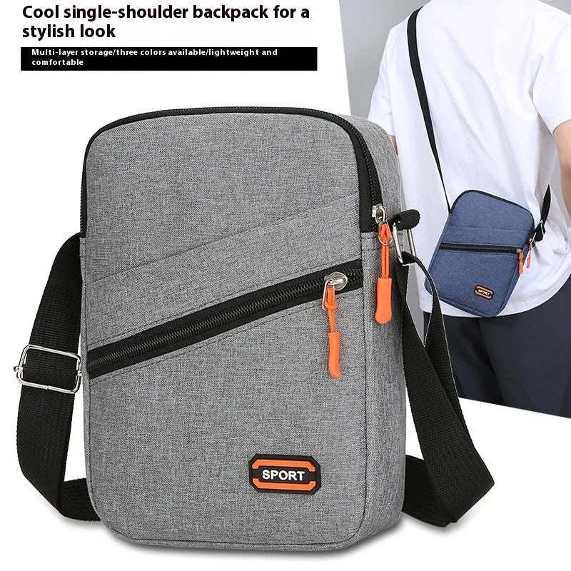 Simple solid-colour Oxford cloth crossbody commuter bag in silver grey, black, or navy blue.