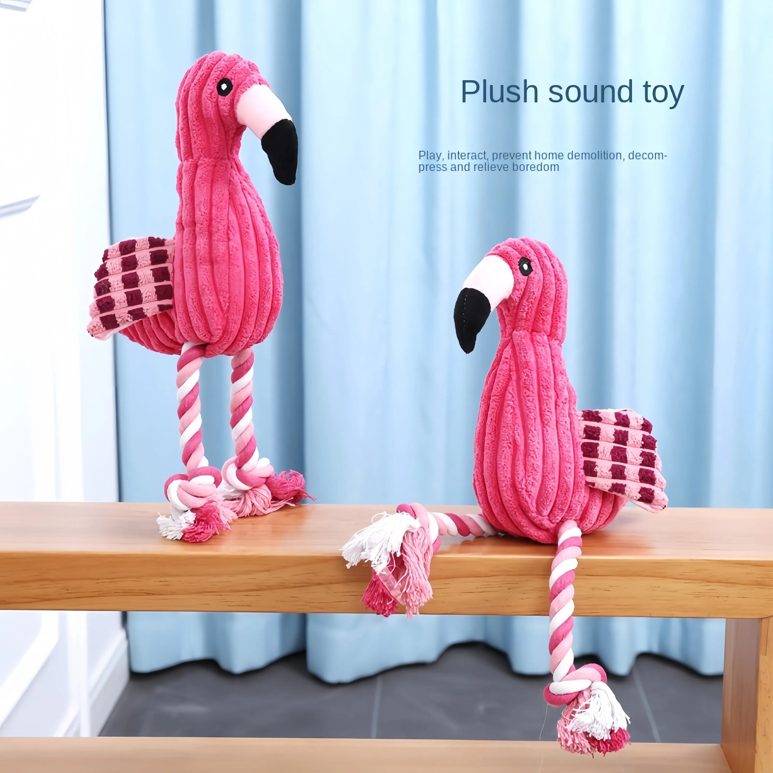 Pink corduroy plush dog toy shaped like a lion, elephant, or giraffe with a squeaker.