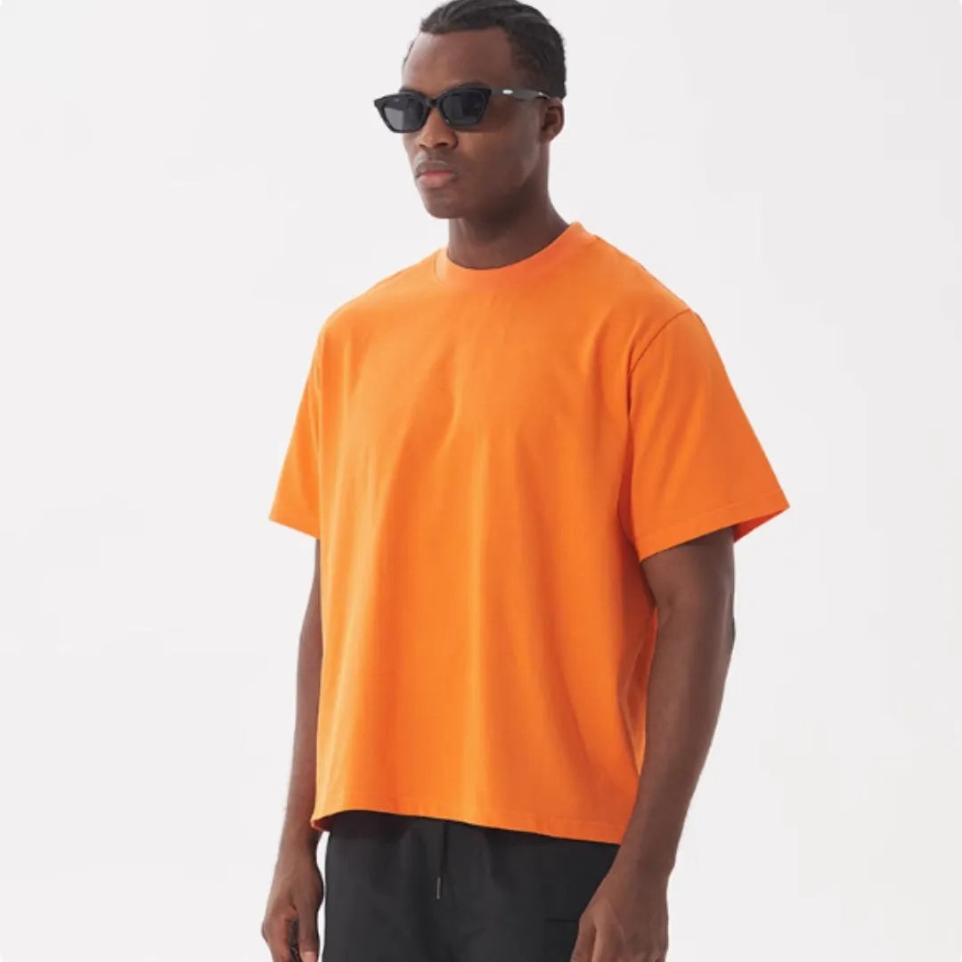 American style loose fit pure cotton t-shirt in apricot colour on a hanger.