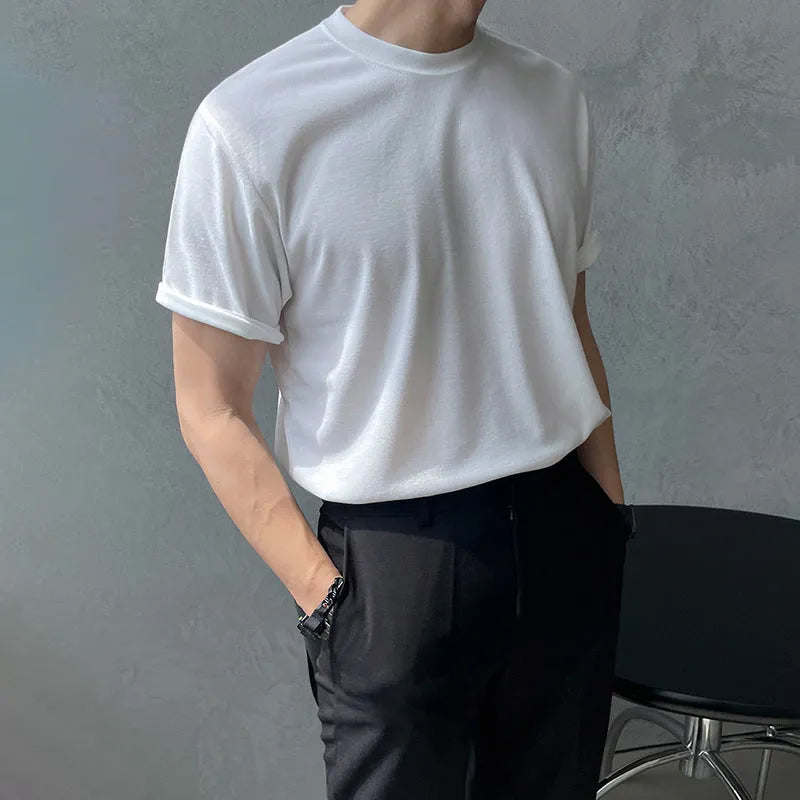 Men's slim fit cotton T-shirt in solid white colour, showing round neck and half sleeve design.
