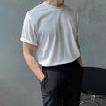 Men's slim fit cotton T-shirt in solid white colour, showing round neck and half sleeve design.