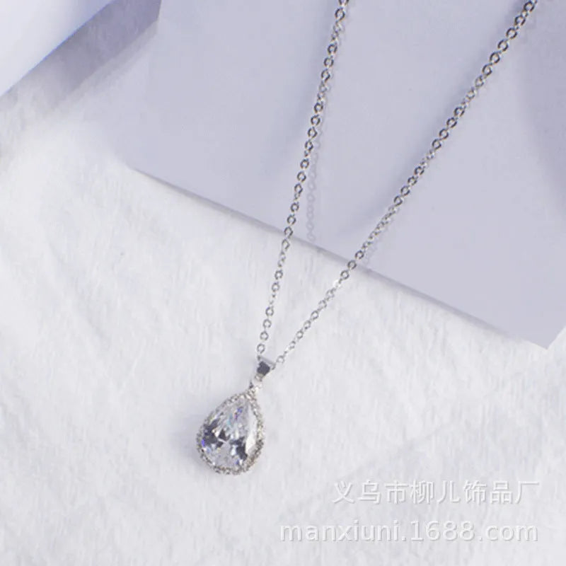 Rose gold pink drop shape women's necklace with geometric rhinestone detailing and alloy construction