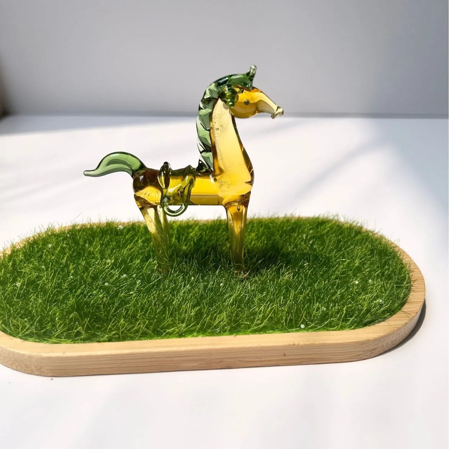 Brown glazed ceramic horse decoration on wooden desk with modern simplicity design
