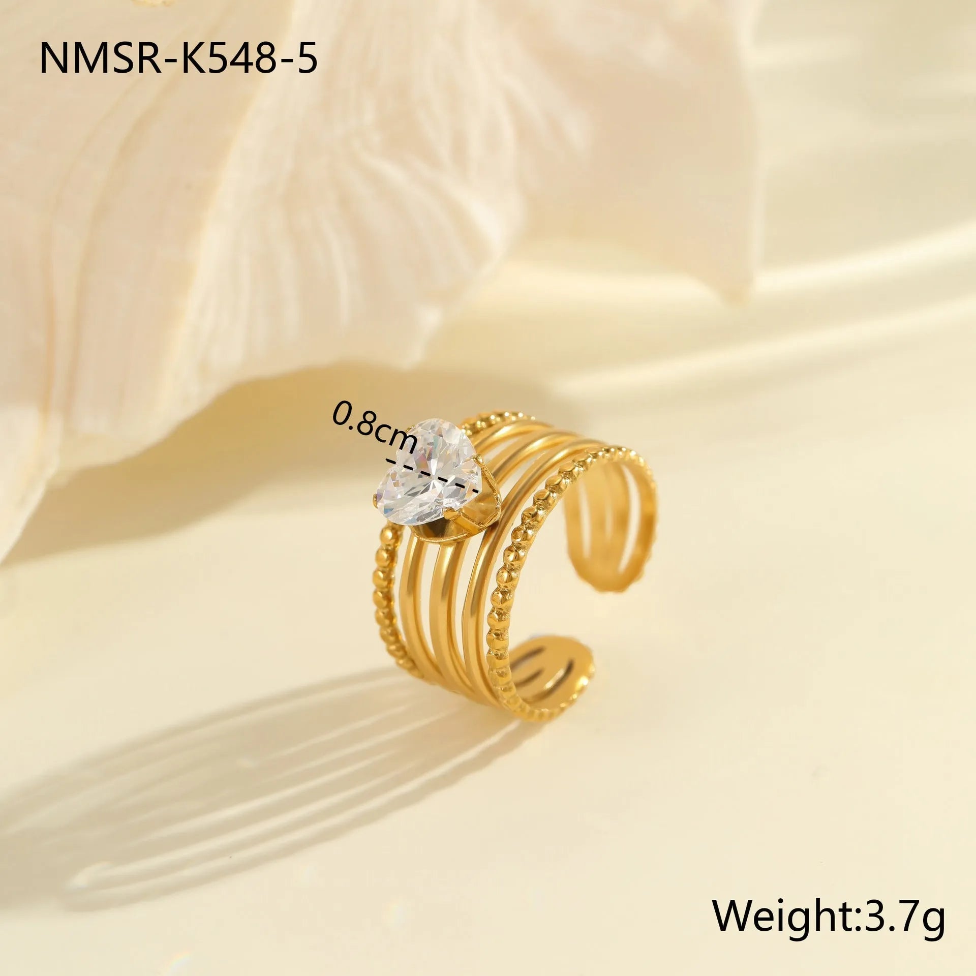 Gold-coloured stainless steel open ring with zircon stones in a geometric heart design.