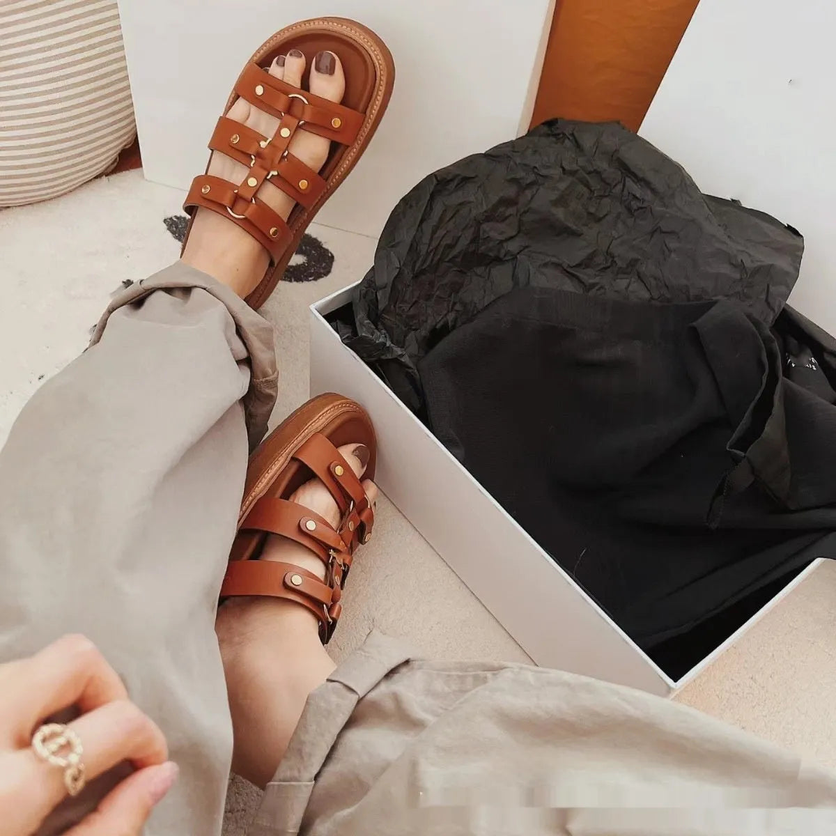 Women's brown retro Roman style sandal slippers with a sheepskin upper and patent leather finish.