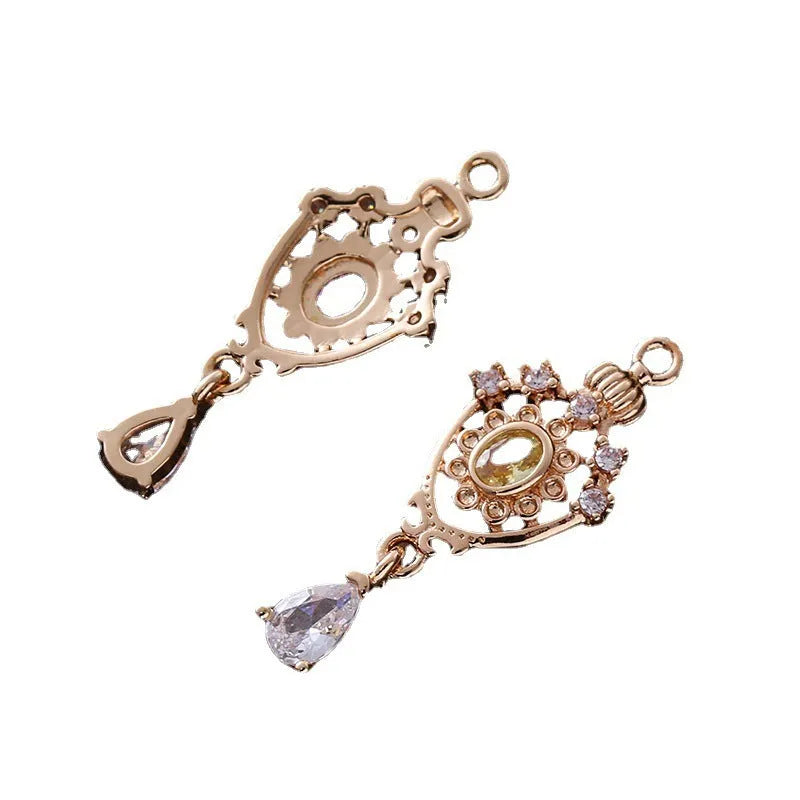 Water drop pendant with zircon crown detail in copper with electroplated finish.