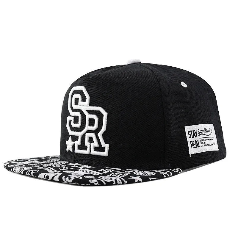Cotton baseball hat with embroidered letters on a dome crown, shown in black and white.