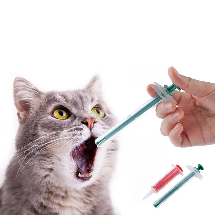 Two soft-tip silica gel pet pill shooters for cats and dogs on a white background