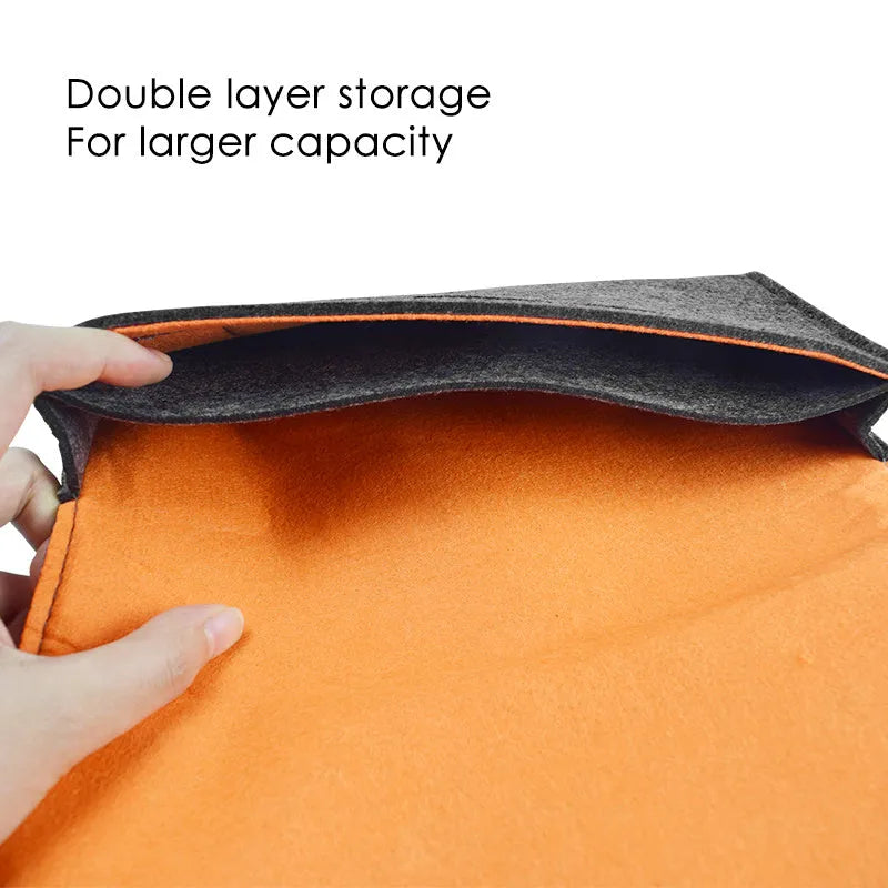 Black felt carrying pouch for Nintendo Switch console with game card slots and double storage layers.