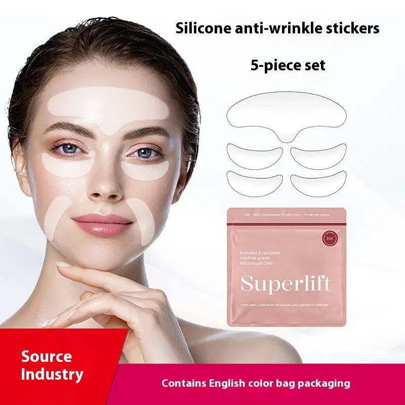 Five transparent silicone anti-wrinkle face stickers laid flat