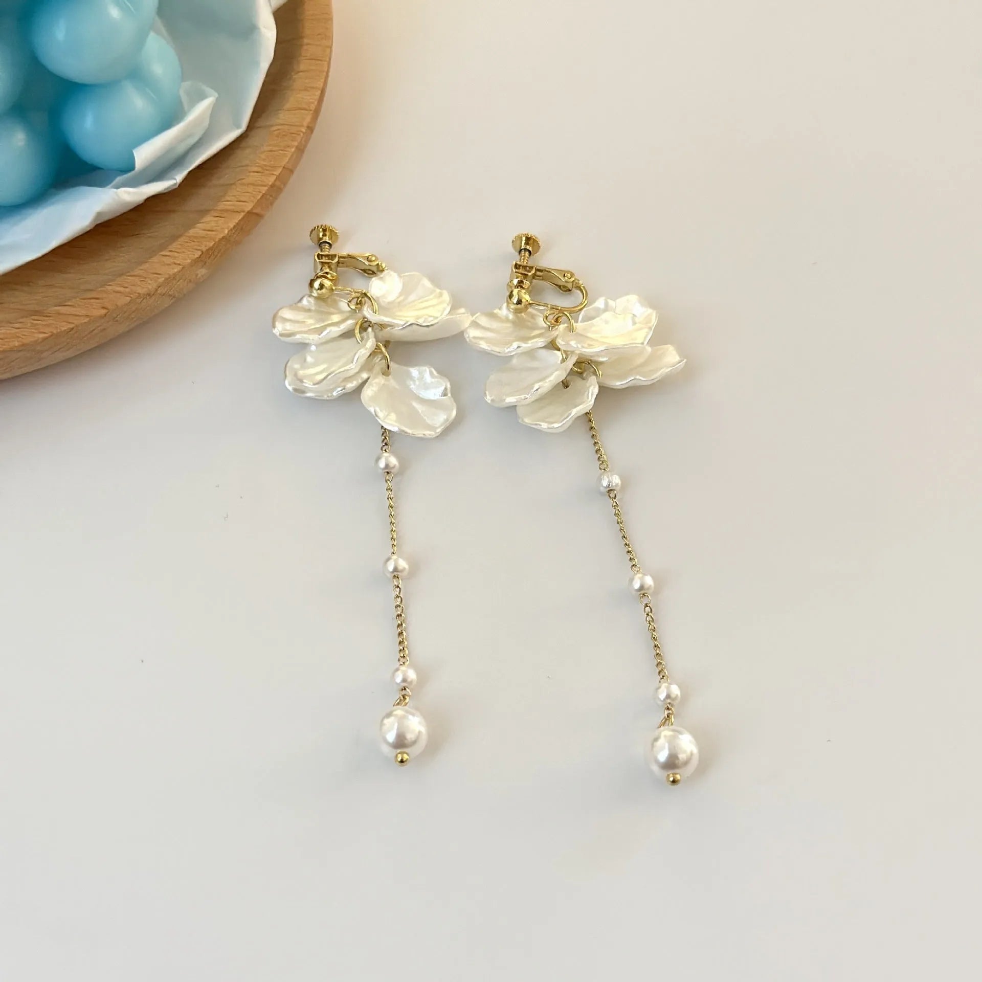 Women's acrylic shell pearl tassel earrings showing length, with a choice of four ear clip types.