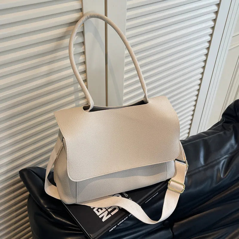 Square synthetic leather tote bag with double straps in a neutral colour.