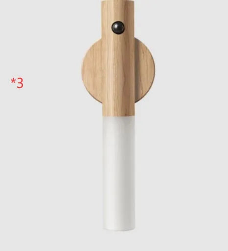 Smart sensor LED desk lamp in wood and glass, showing compact size and warm white light.