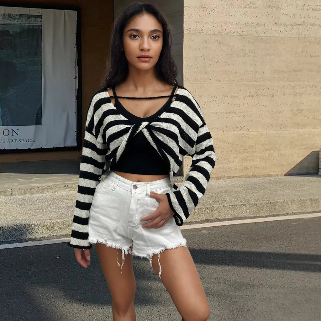 A woman's striped long-sleeve pullover sweater with a front and back wearable design in mercerised cotton.