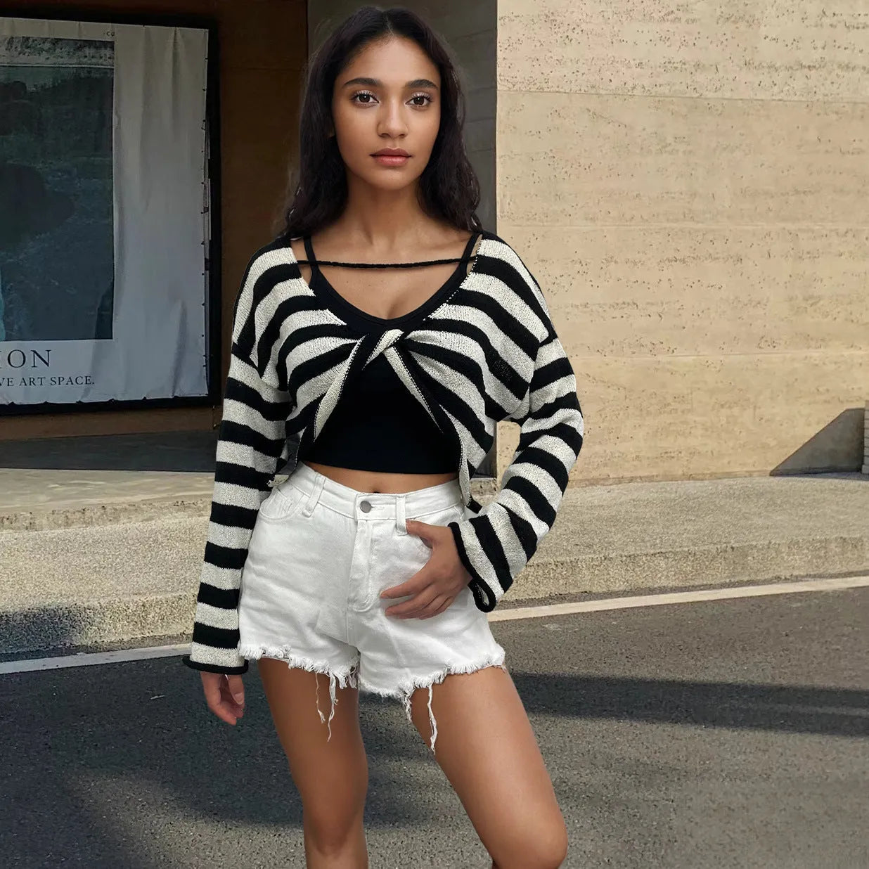 A woman's striped long-sleeve pullover sweater with a front and back wearable design in mercerised cotton.