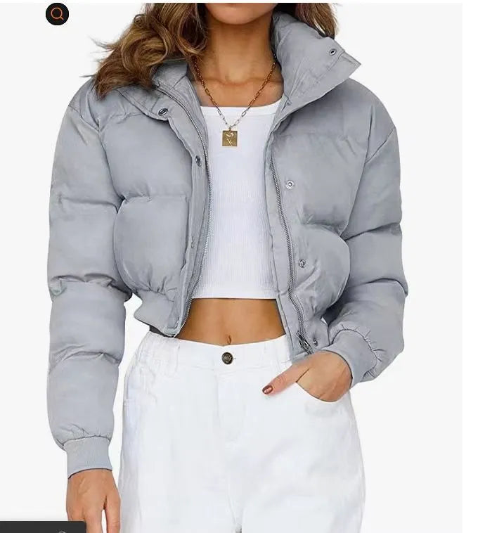 Women's loose blue polyester jacket with regular long sleeves showing front view