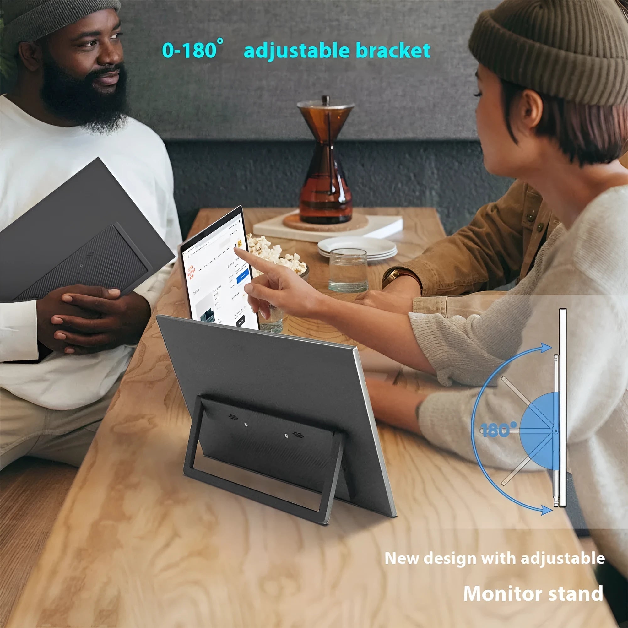 Black 15.6 inch portable computer monitor with adjustable stand on office desk
