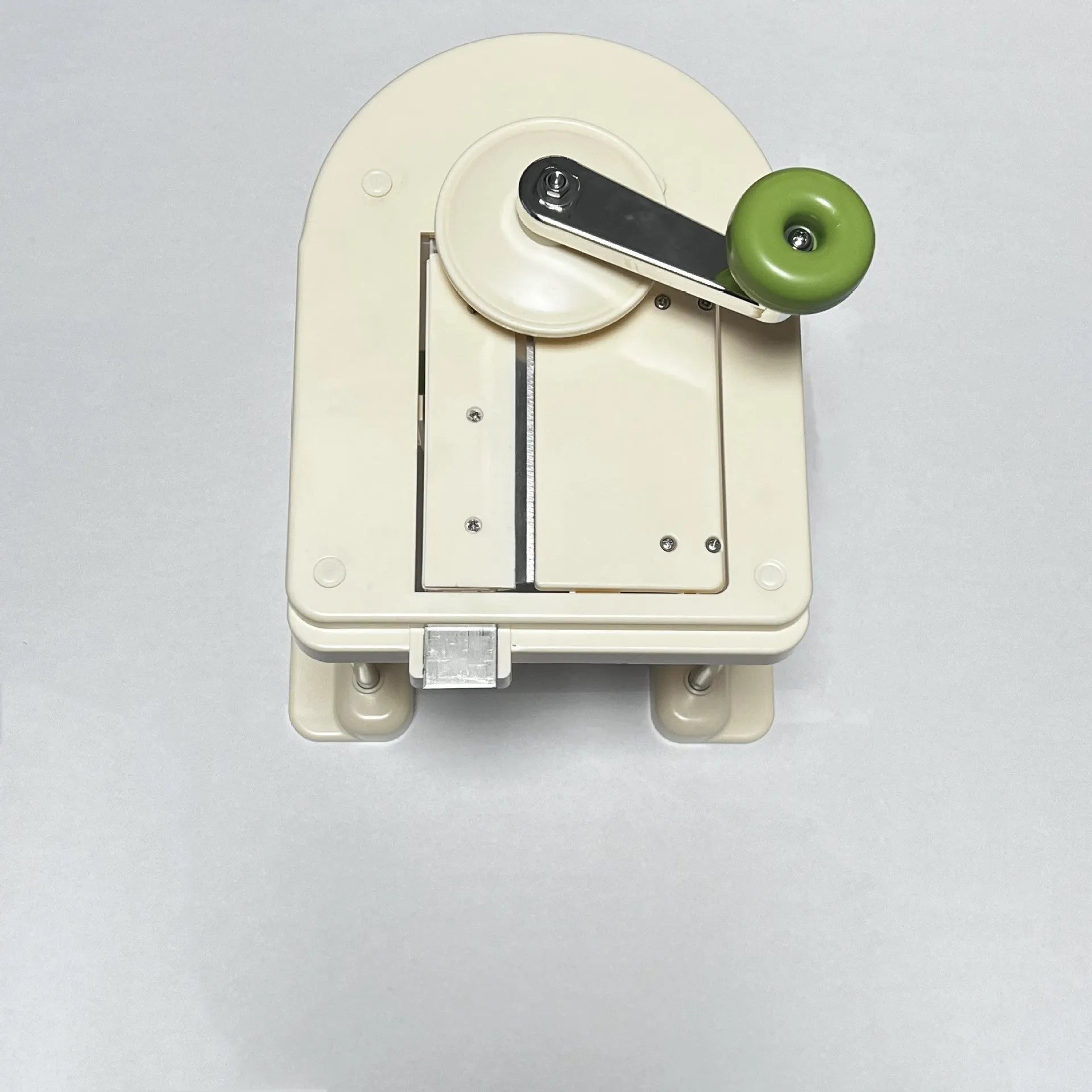 Beige household vegetable slicer and grater with stainless steel blades