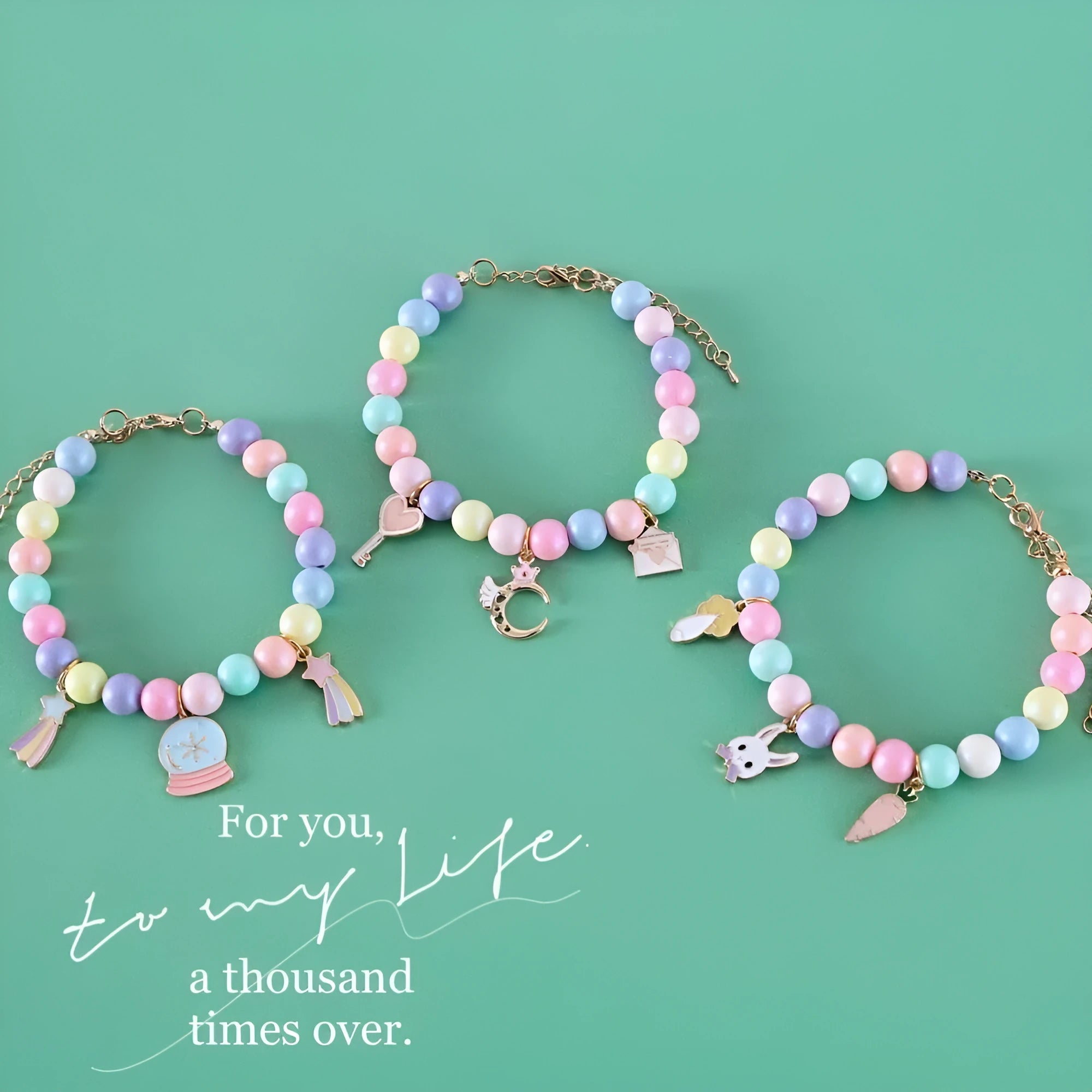 Macaron-colour pet collar with moon and pearl resin charms and a matching bracelet.