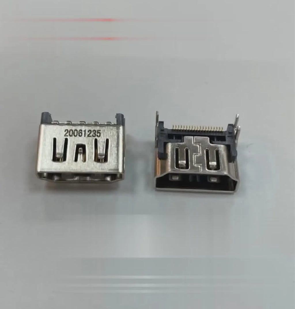 Silver-coloured HDMI host socket interface for game console repair.