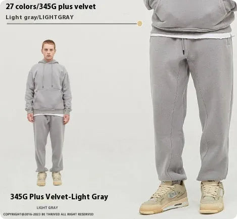 Men's solid colour cotton velvet casual sweatpants with elasticated waist and ankle cuffs.
